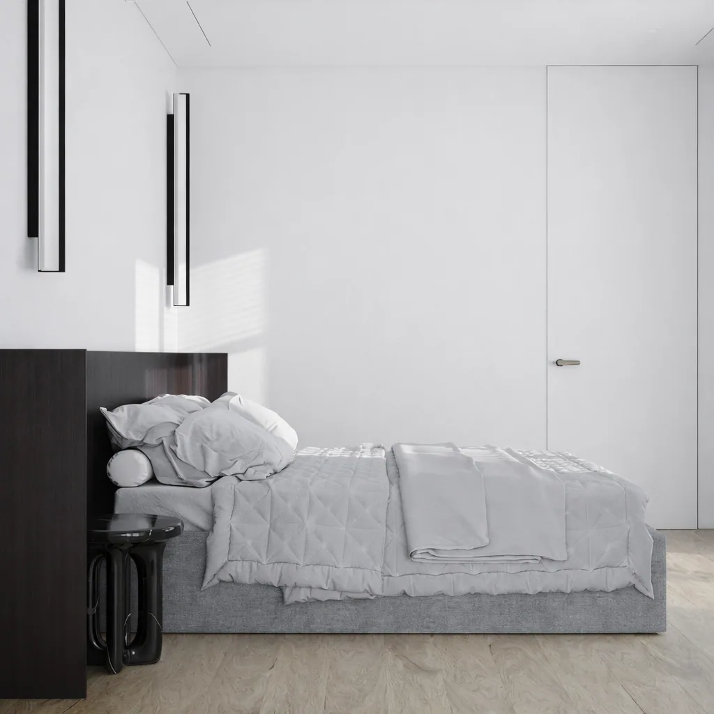 Side view of the bedroom with pale walls and integrated dark timber joinery