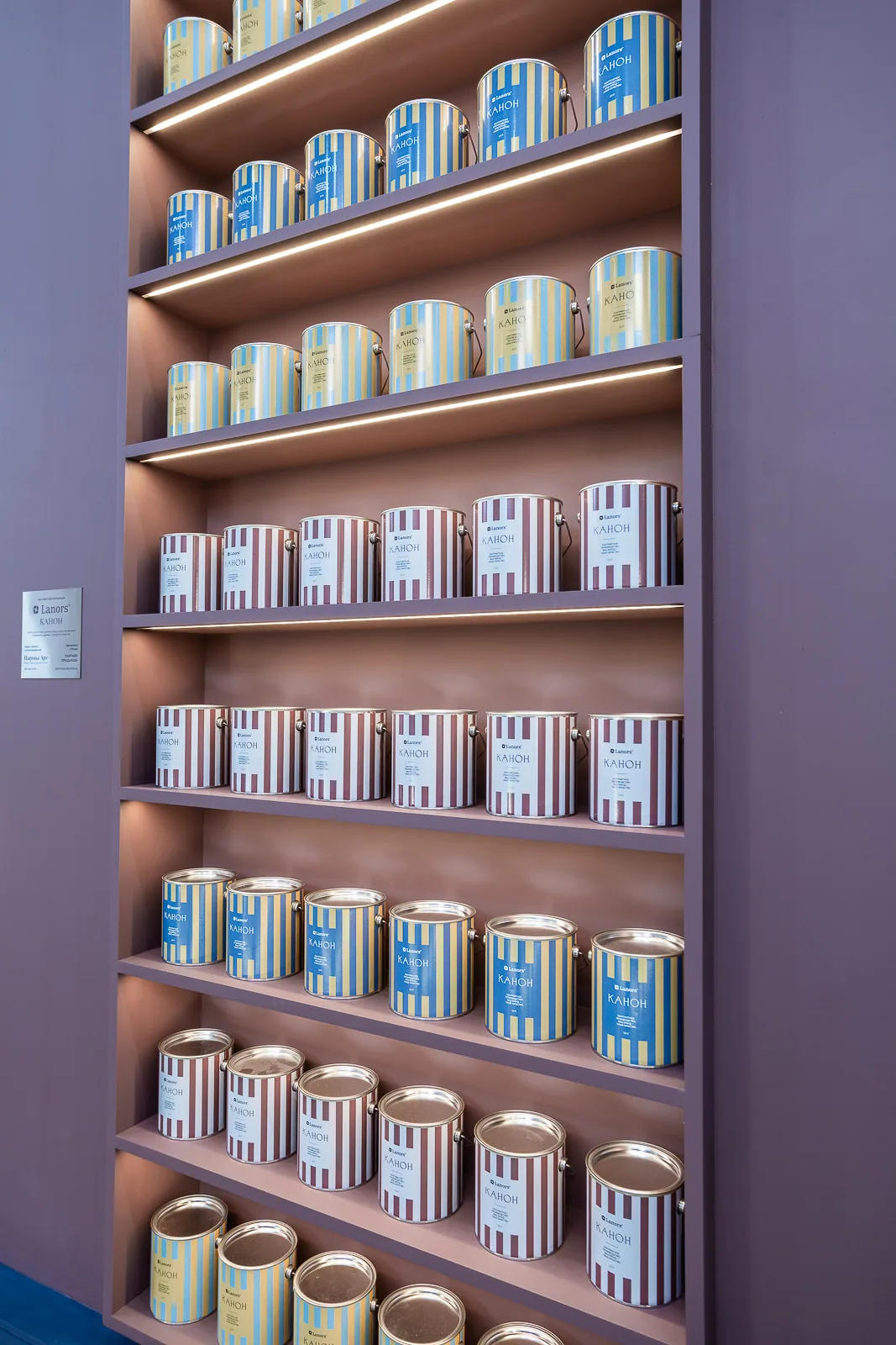 Illuminated shelves of Lanors product containers inside the manufacturing pavilion