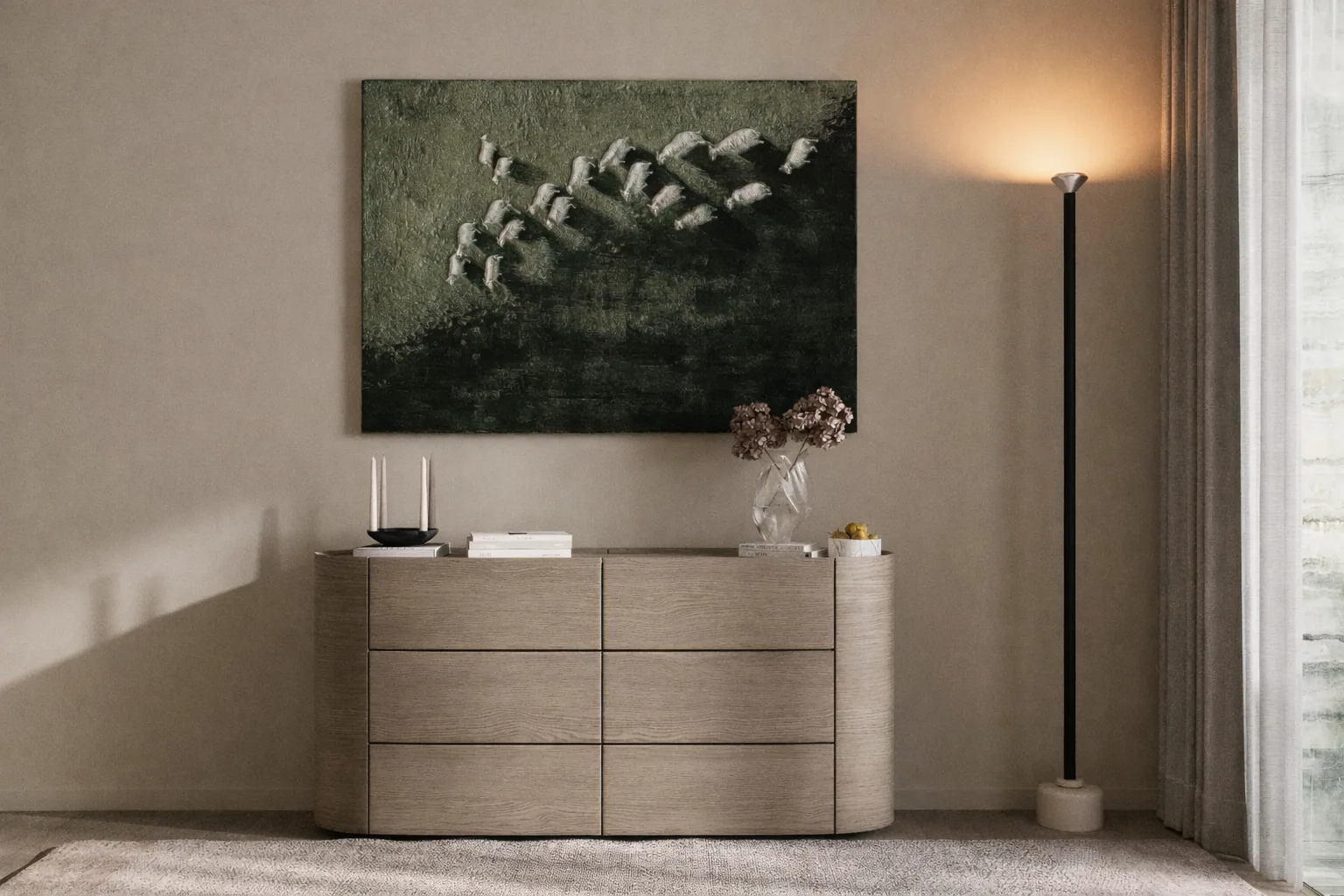 Bedroom console beneath an abstract artwork and a warm wall light