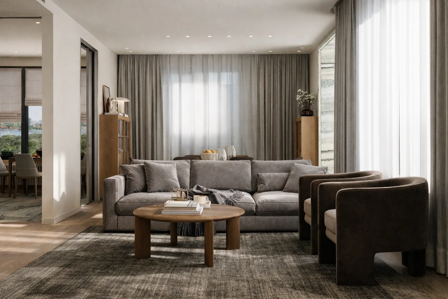 Living room with warm timber planes, soft seating, and full-height curtains