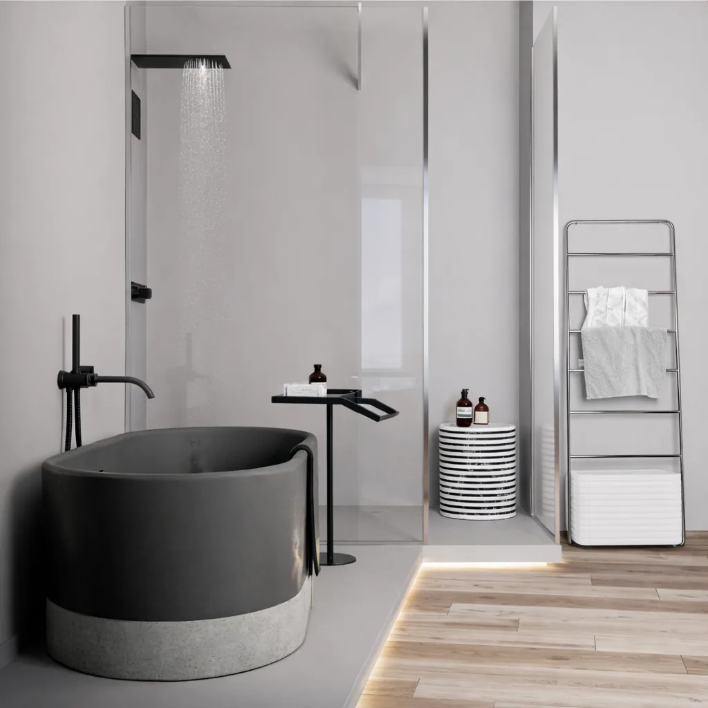 Freestanding dark bath and glass shower in the primary bathroom