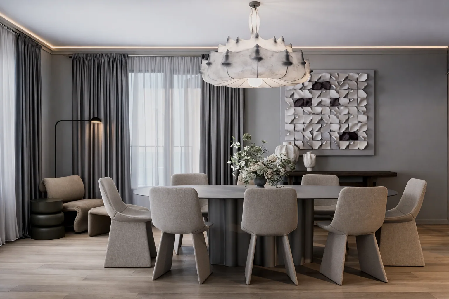 Dining table beneath the white chandelier with the living room beyond