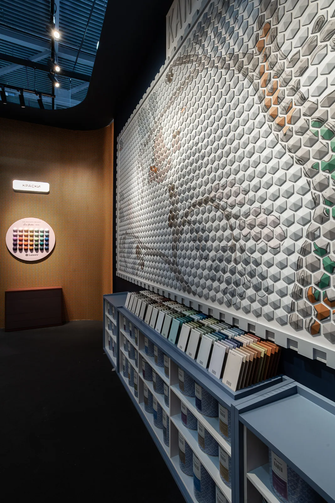 Angled view of the KANVA mosaic and illuminated material display