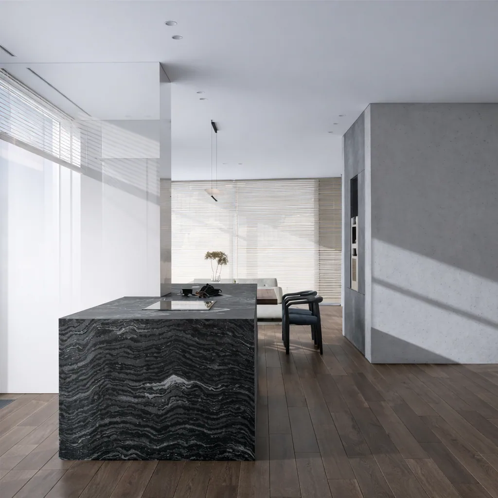 Dark stone kitchen island aligned with the dining area and panoramic glazing