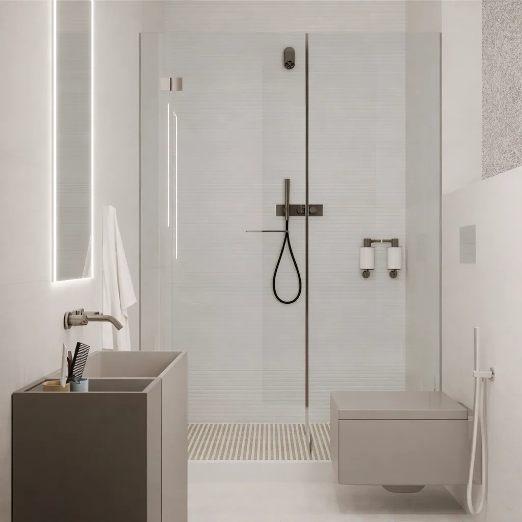 Pale guest bathroom with a glass shower and dark fittings
